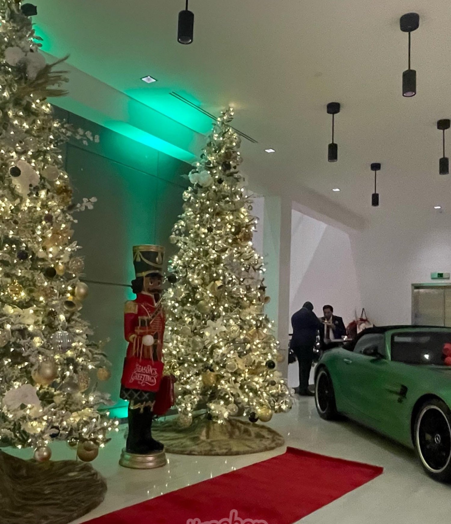 White flocked trees and nutcracker in a showroom